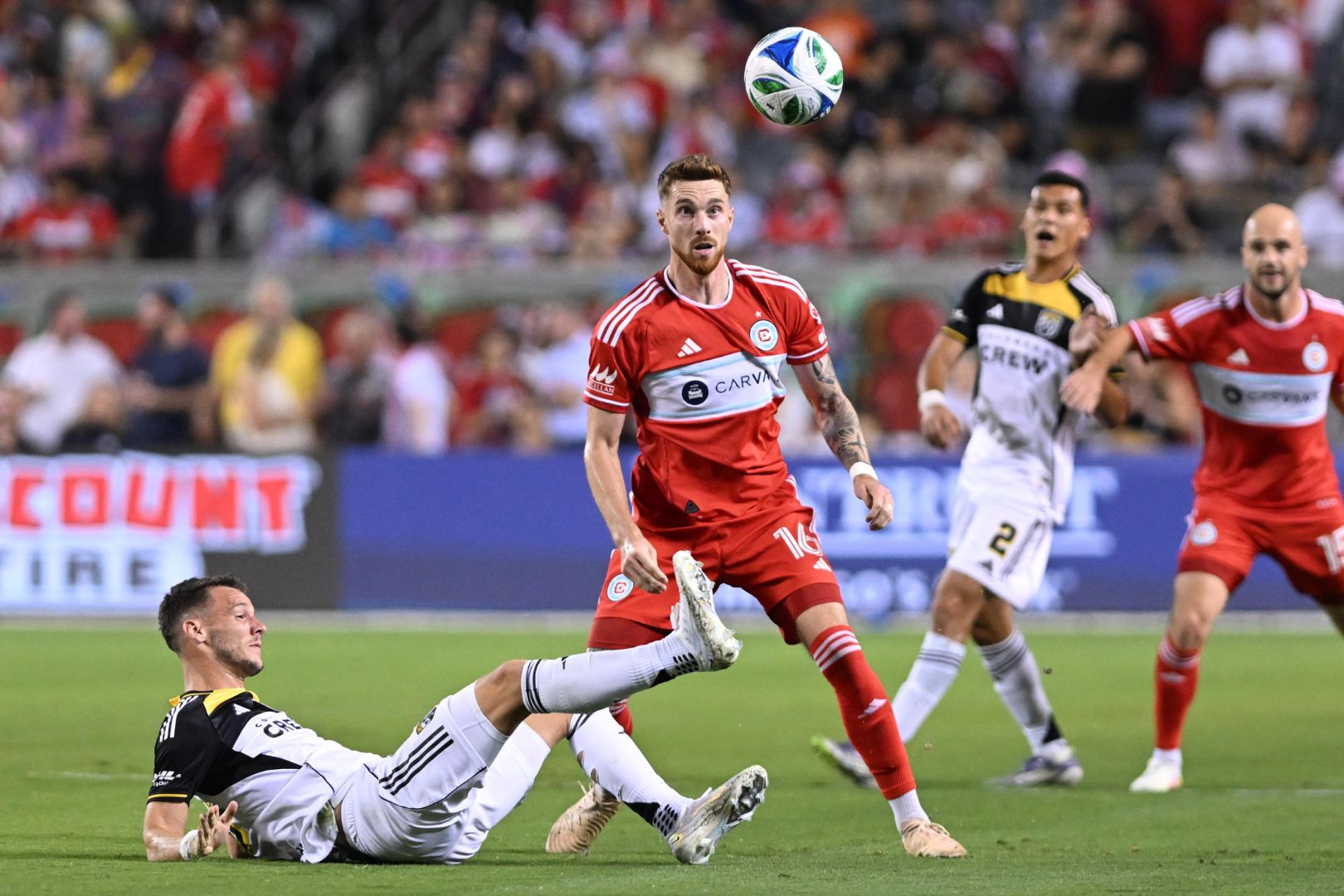 Joel Waterman looks at the ball in the air during the Fire's game against the Columbus Crew on September 27, 2025.