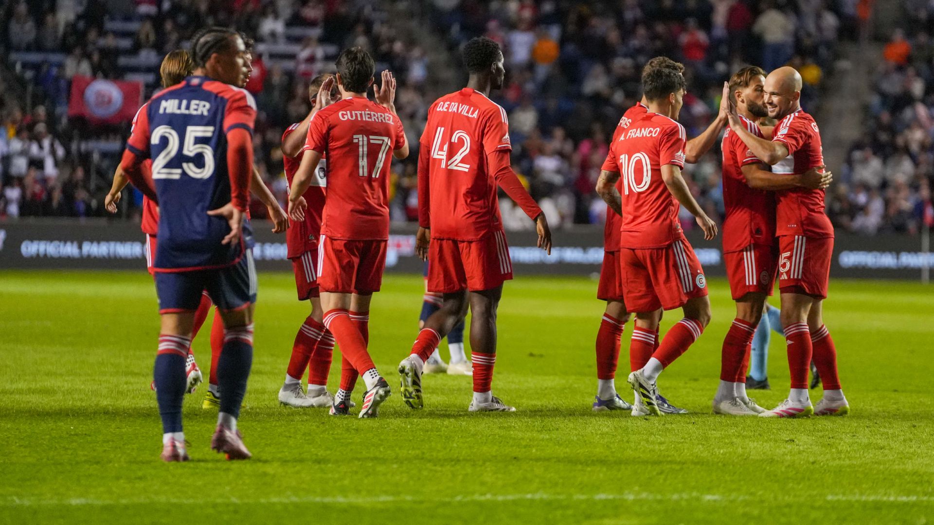 Chicago Fire FC players celebrate while playing against New England Revolution at SeatGeek stadium in Bridgeview, IL on September 6, 2025.