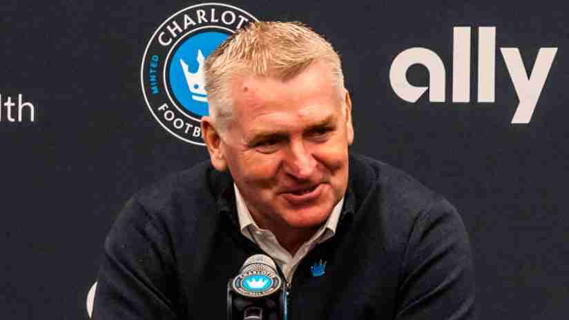 close up image of Charlotte FC coach Dean Smith speaking into a microphone