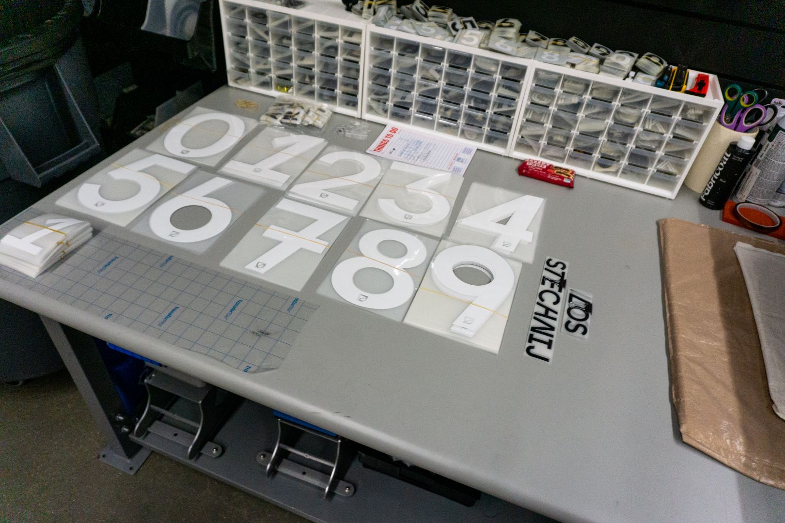 Numbers and letters for player jerseys at the equipment room of the Endeavor Health Performance Center on March 3, 2025