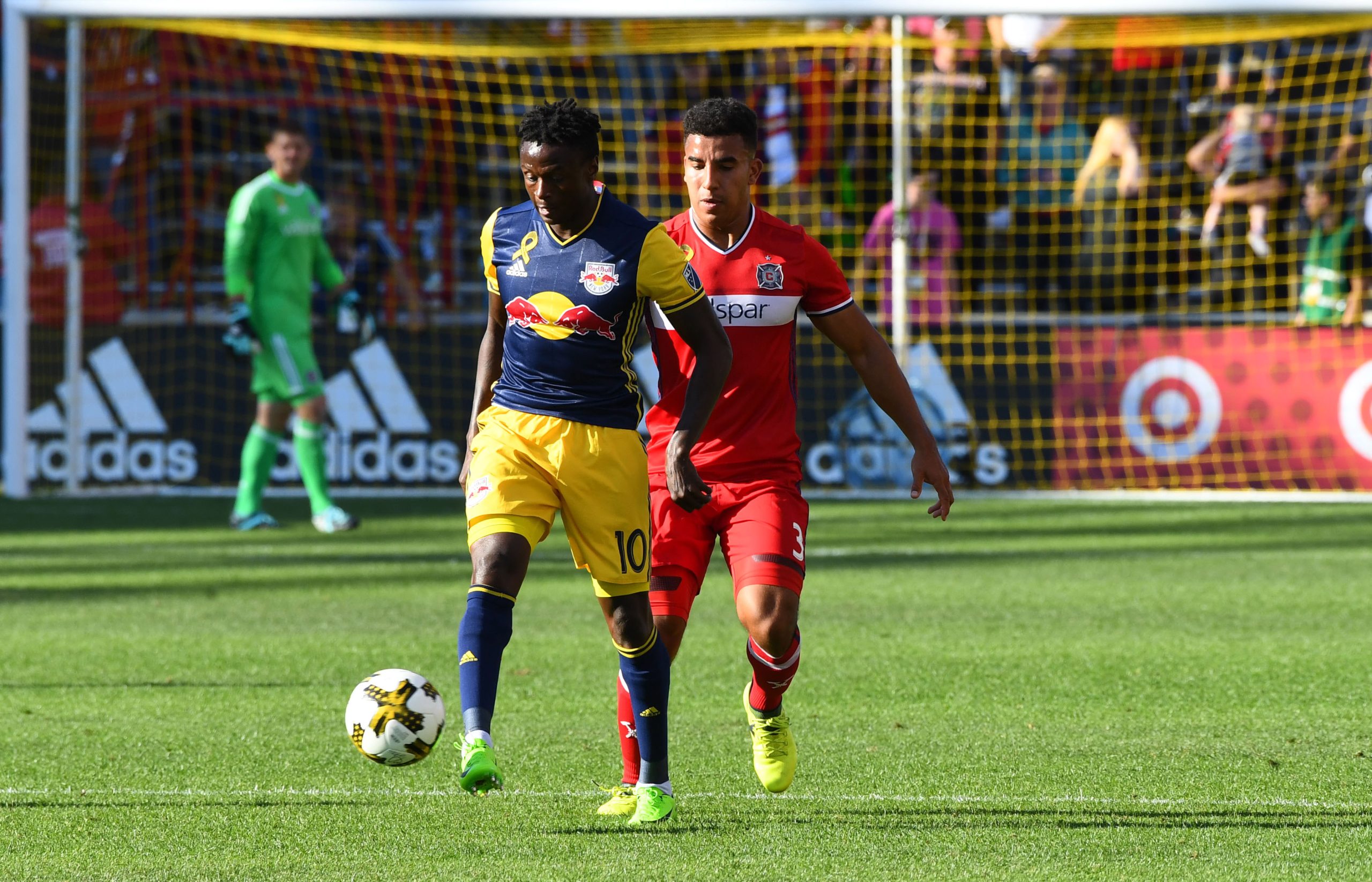 Sep 9, 2017; Chicago, IL, USA; New York Red Bulls forward Muhamed Keita (10) kicks the ball past Chicago Fire defender Brandon Vincent (3) during the second half at Toyota Park. Mandatory Credit: Mike DiNovo-USA TODAY Sports