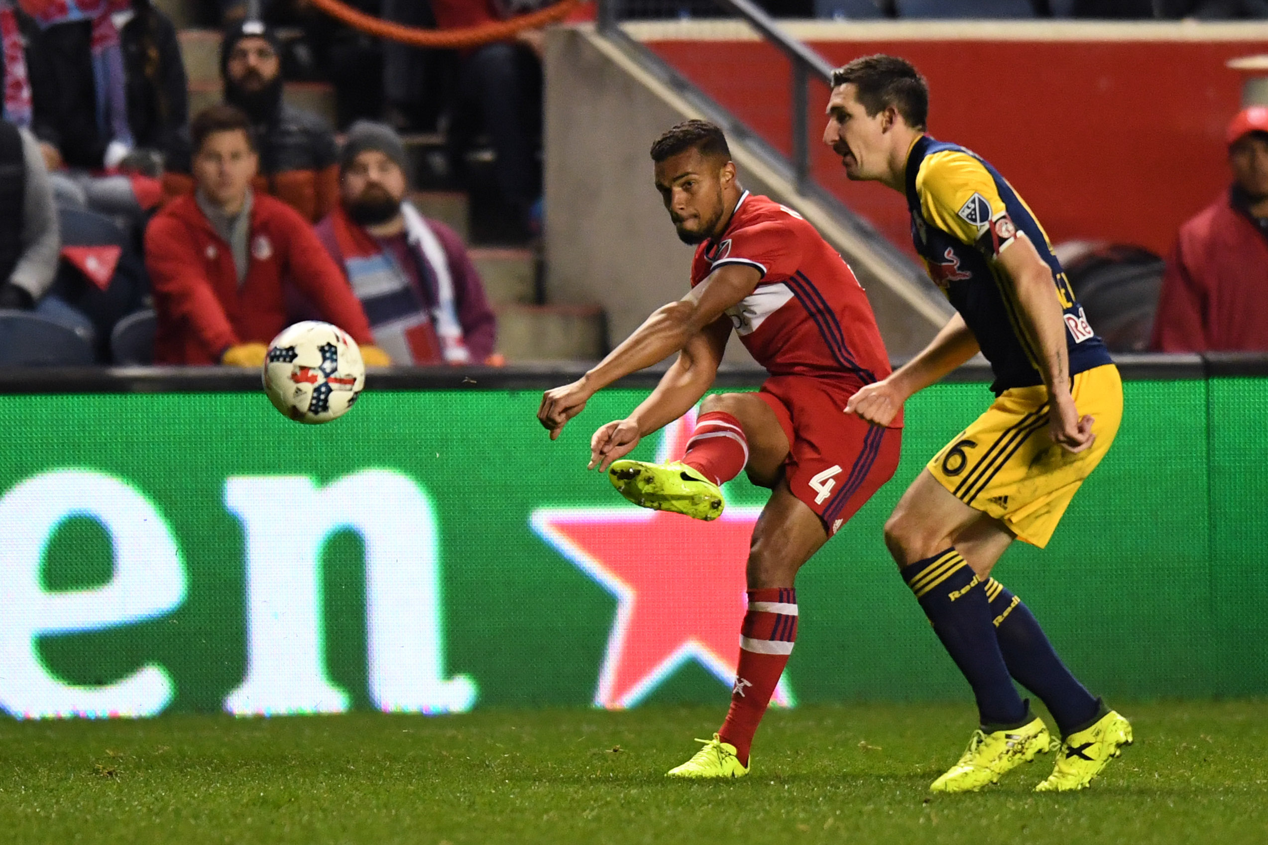 Oct 25, 2017; Chicago, IL, USA; Chicago Fire defender Johan Kappelhof (4) passes the ball against the New York Red Bulls midfielder Sacha Kljestan (16) during an Eastern Conference knockout round soccer game at Toyota Park. Red Bulls won 4-0. Mandatory Credit: Patrick Gorski-USA TODAY Sports