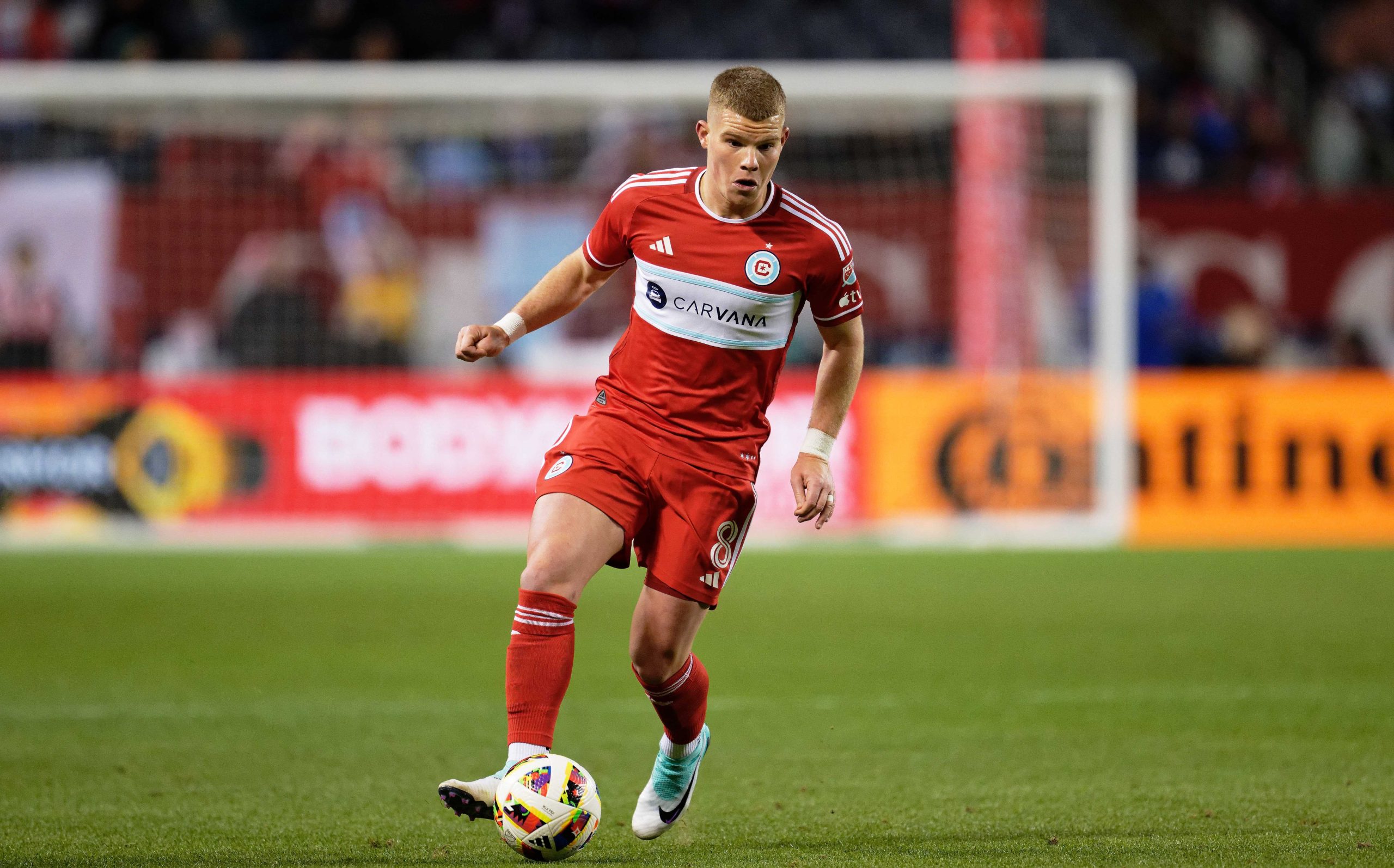 Apr 20, 2024; Chicago, Illinois, USA; Chicago Fire FC forward Chris Mueller (8) controls the ball against Real Salt Lake at Soldier Field. Mandatory Credit: Jamie Sabau-USA TODAY Sports
