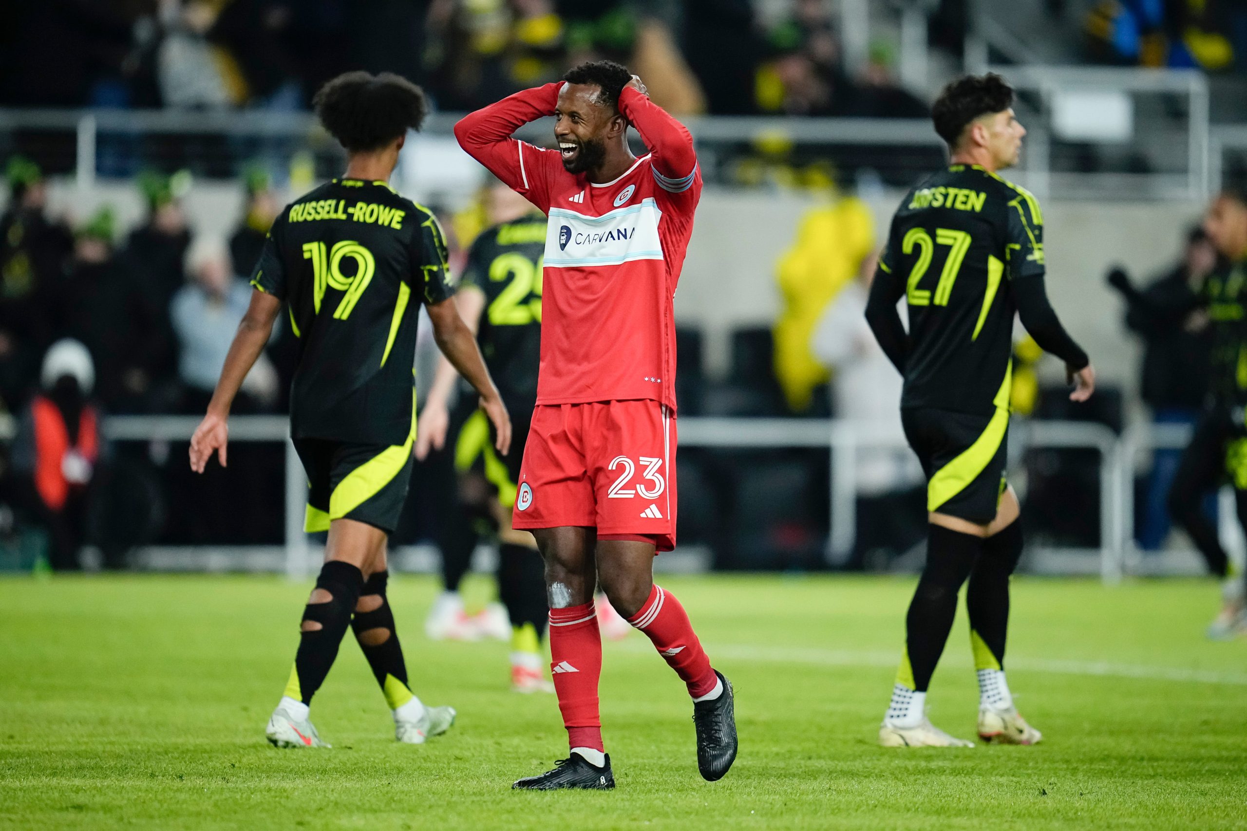 Chicago Fire FC midfielder Kellyn Acosta (23) reacts to an own goal during the first half of the MLS soccer match against the Columbus Crew at Lower.com Field in Columbus on Feb. 22, 2025.