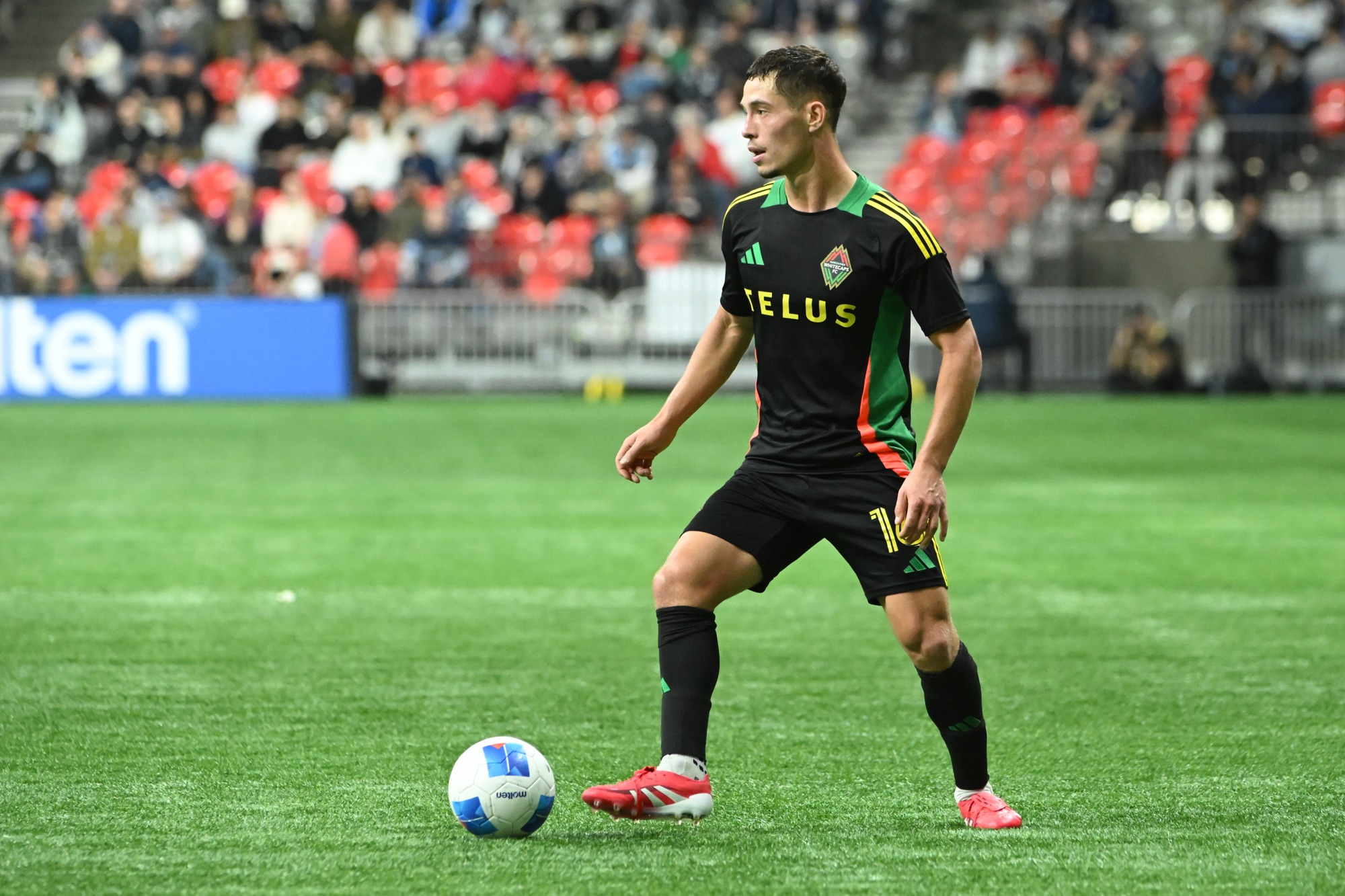 Feb 27, 2025; Vancouver, British Columbia, USA; Vancouver Whitecaps FC midfielder Sebastian Berhalter (16) dribbles the ball during the first half against Saprissa at BC Place Stadium.