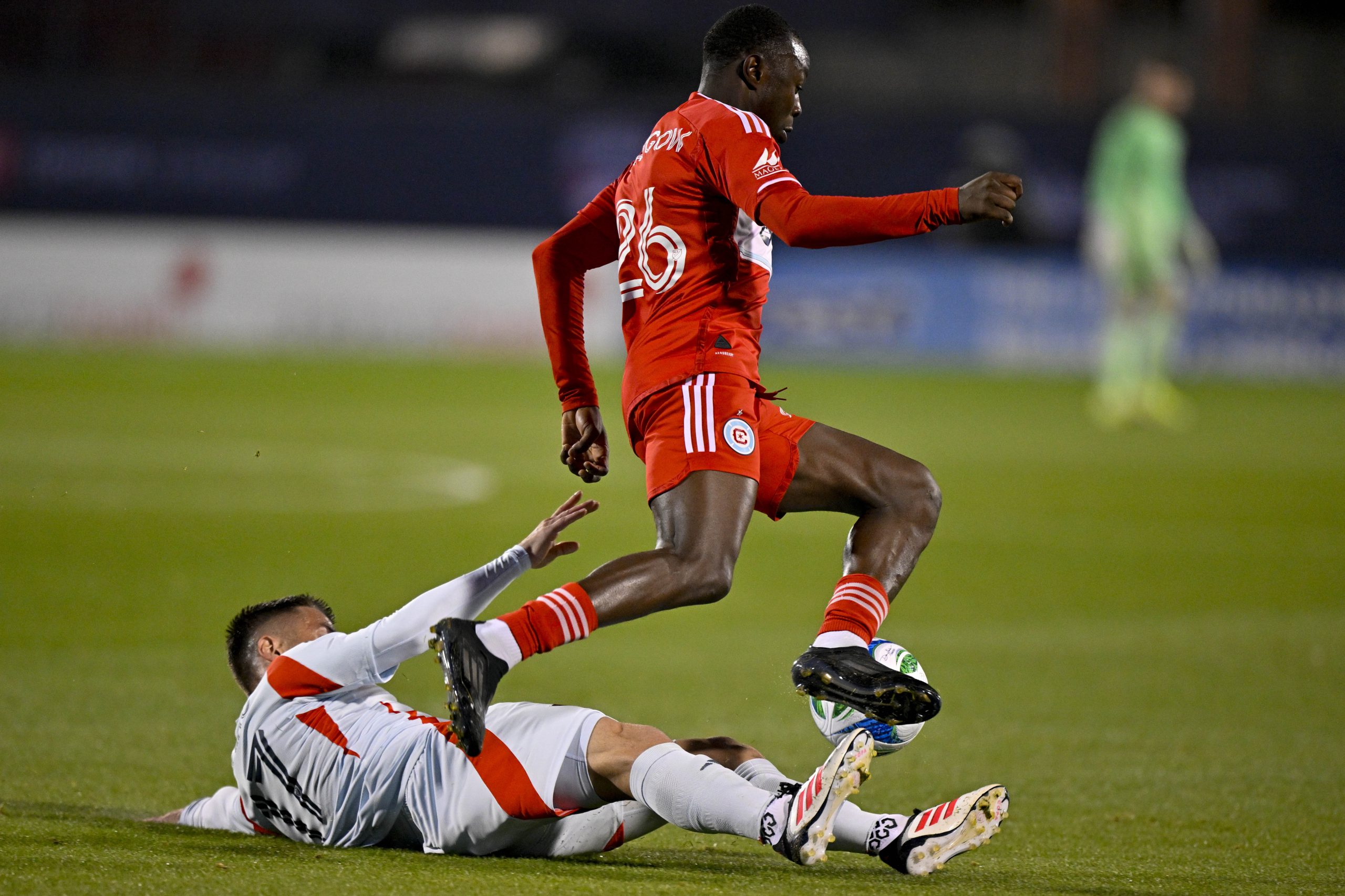 Mar 8, 2025; Frisco, Texas, USA; FC Dallas midfielder Ramiro (17) and Chicago Fire forward Omari Glasgow (26) chase the ball during the first half at Toyota Stadium. Mandatory Credit: 