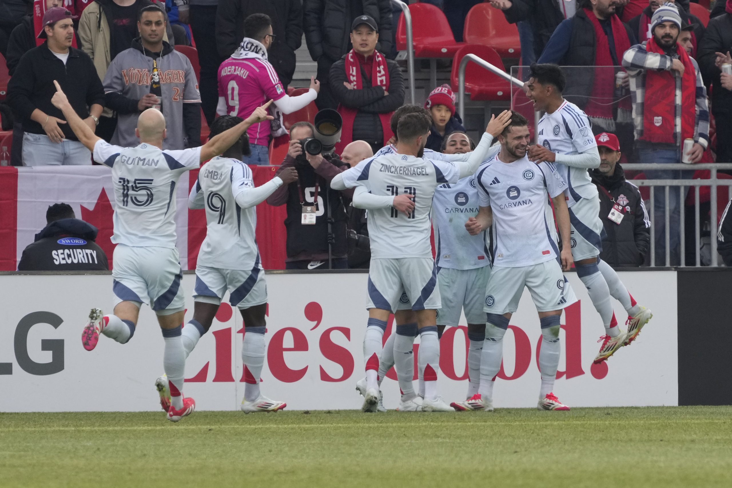 Mar 15, 2025; Toronto, Ontario, CAN; Chicago Fire forward Hugo Cuypers (9) gets congratulated  by teammates after scoring against Toronto FC during the first half at BMO Field. Mandatory Credit: John E. Sokolowski-Imagn Images