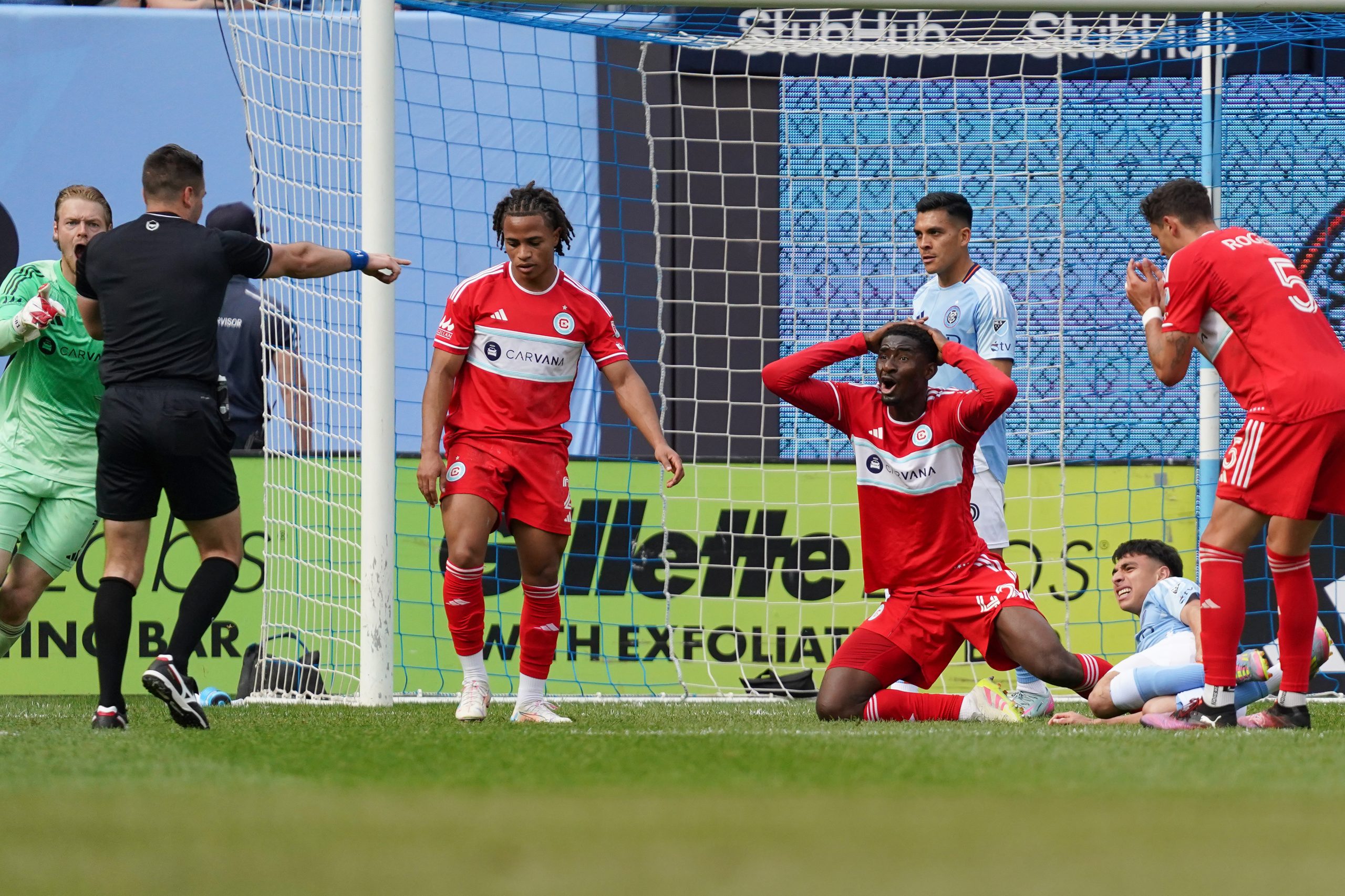 May 25, 2025; New York, New York, USA; Chicago Fire midfielder D'Avilla Dje Tah (42) reacts after being called for a second yellow card in the box during the second half against New York City FC at Yankee Stadium. Mandatory Credit: Lucas Boland-Imagn Images