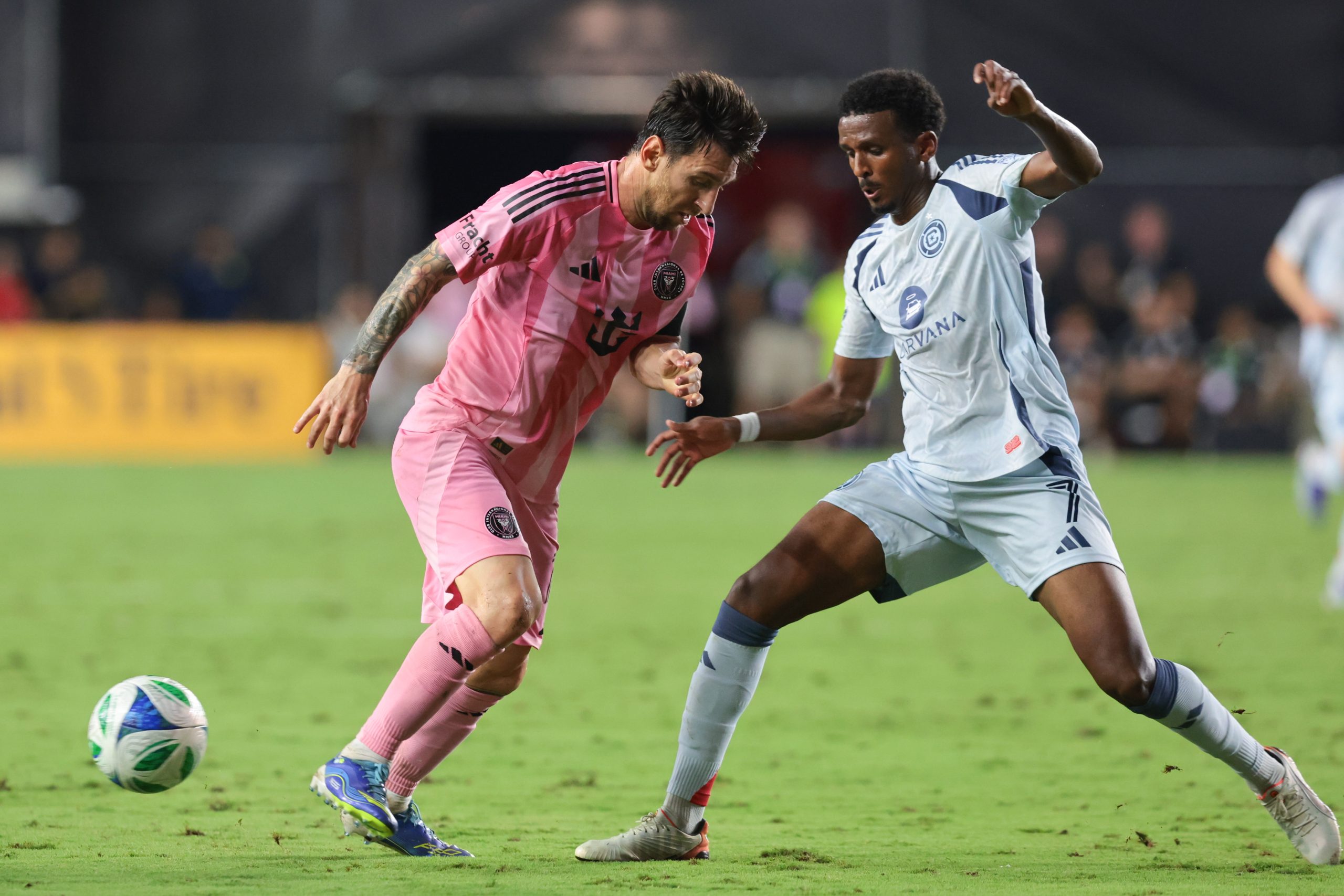Sep 30, 2025; Fort Lauderdale, Florida, USA; Chicago Fire midfielder Maren Haile-Selassie (7) defends against Inter Miami CF forward Lionel Messi (10) during the second half at Chase Stadium. Mandatory Credit: Sam Navarro-Imagn Images
