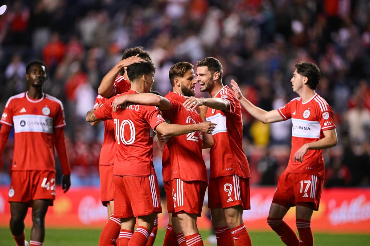 Hugo Cuypers, André Franco and other Chicago Fire players celebrate scoring a goal against New England Revolution at SeatGeek