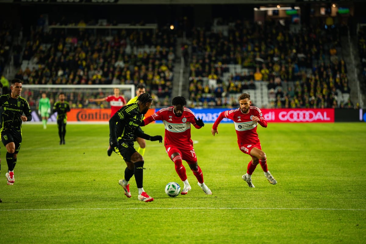 Jonathan Bamba and Philip Zinckernagel play the ball against the Columbus Crew on February 22, 2025 at Lower.com Field in Col