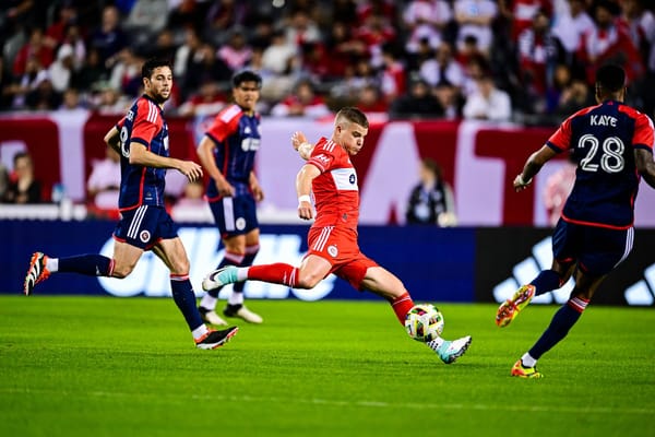 Chris Mueller strikes the ball against the New England Revolution on May 4, 2025