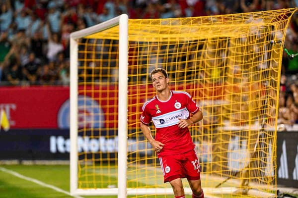 Tom Barlow close in shot after scoring a goal with the net in the background