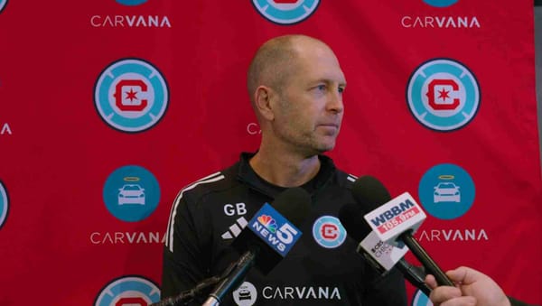 Close in shot of Gregg Berhalter with microphones in front of a Chicago Fire