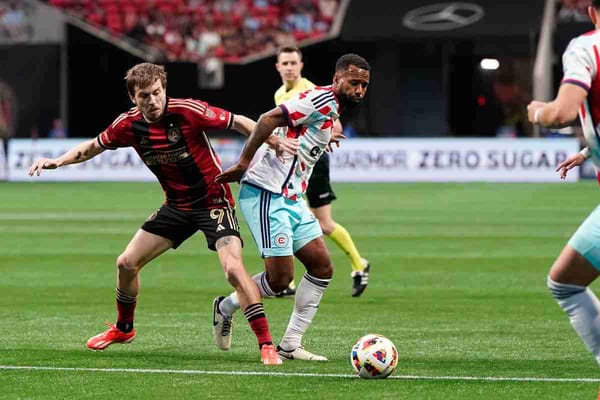 Three soccer plasyers fight for the ball during a soccer game for the Chicago Fire against Atlanta United FC in MLS