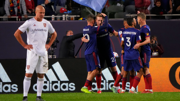 Chicago Fire players celebrate a goal on the pitch at Soldier Field
