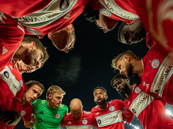 Chicago Fire players huddle before facing the Columbus Crew in their season opener on February 22, 2025 at Lower.com Field in