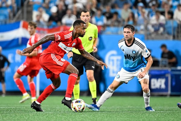 Oct 2, 2024; Charlotte, North Carolina, USA; Chicago Fire midfielder Kellyn Acosta (23) with the ball as Charlotte FC midfiel
