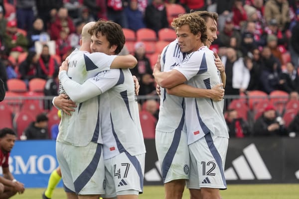 Mar 15, 2025; Toronto, Ontario, CAN; Chicago Fire midfielder Sam Williams (47) and forward Tom Barlow (12) celebrate a win ov