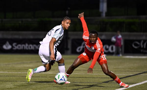 May 20, 2025; Providence, Rhode Island, USA; New England Revolution midfielder Brandon Bye (15) and Chicago Fire defender Oma