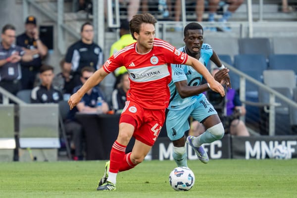 Jul 8, 2025; St. Paul, Minnesota, USA; Chicago Fire midfielder Sam Williams (47) is pressed by Minnesota United forward Tani